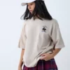 Beige Oversized Graphic T-Shirt for Women – “The Real Minimum” Teddy Print