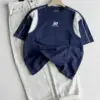 Men Short-Sleeve Contrast Panel T-Shirt with Relaxed Denim Trousers Combo